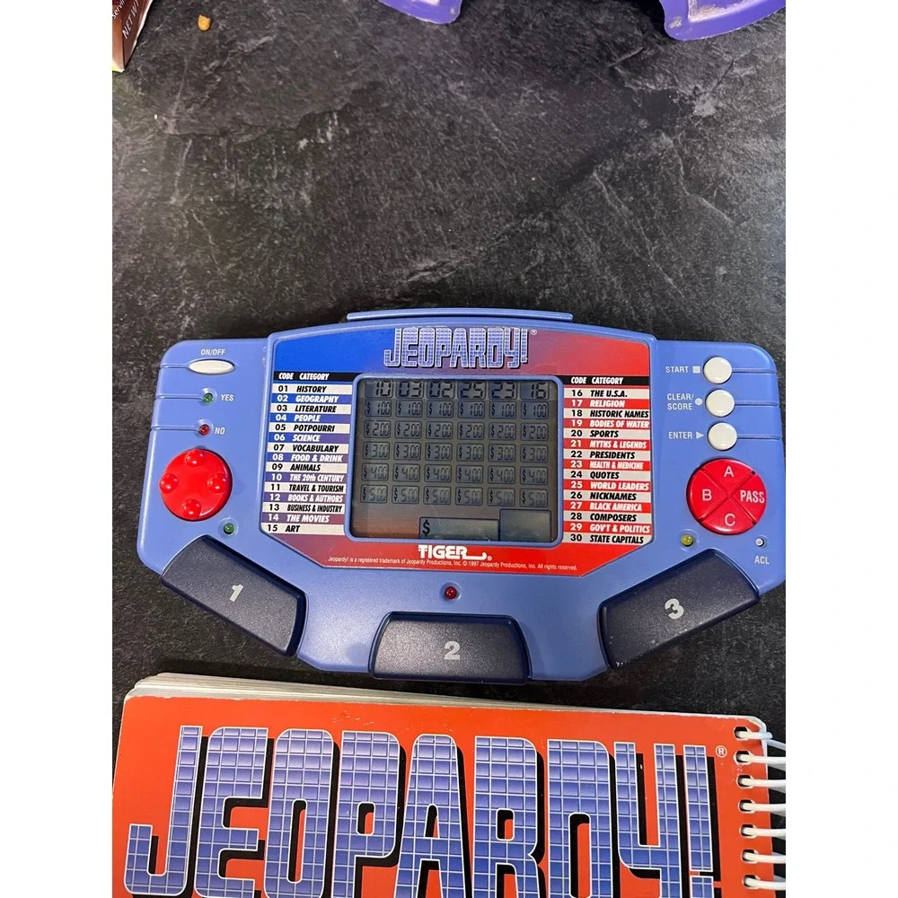 Tiger Electronics‎ Jeopardy Electronic Handheld Game 1997 with Answer  Book